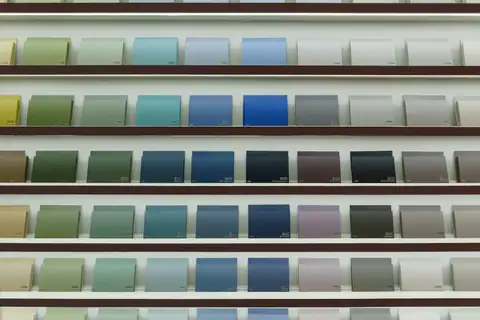 Rows of paint color swatch cards in greens, blues and grays